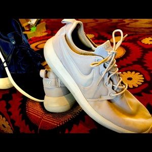 1 pair of Nike shoes, size 13, in gray.